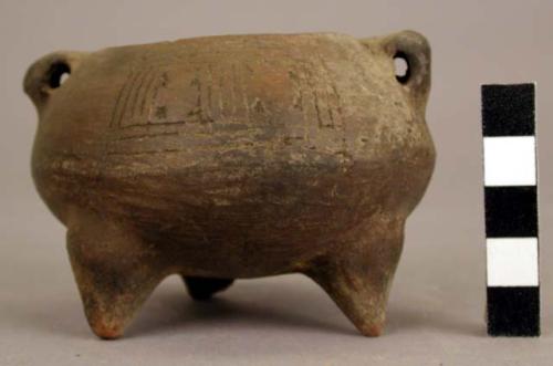 Tripod vessel, incised decoration