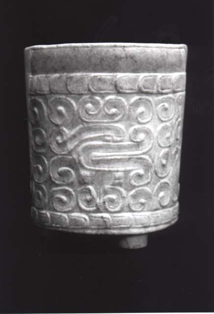 Marble vase - 3 low curcular feet, carved scroll design