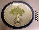 Ceramic polychrome glazed dish, tree motif