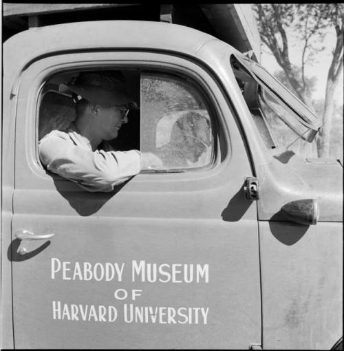 Nicholas England sitting in an expedition truck