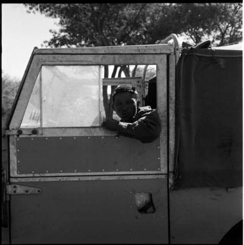 Expedition member sitting in the driver's seat of the expedition Land Rover, looking out of the window