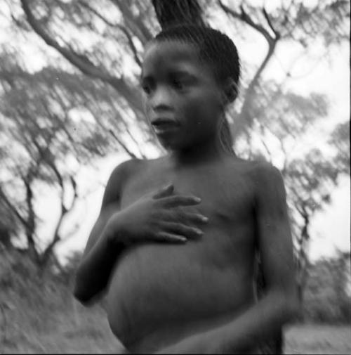 Boy talking, holding his hand on his chest