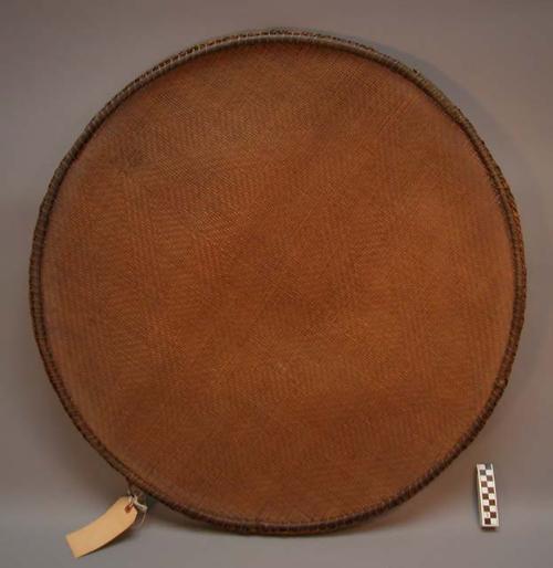 Large woven reed sifting tray