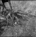 Man putting wood on a fire, close-up