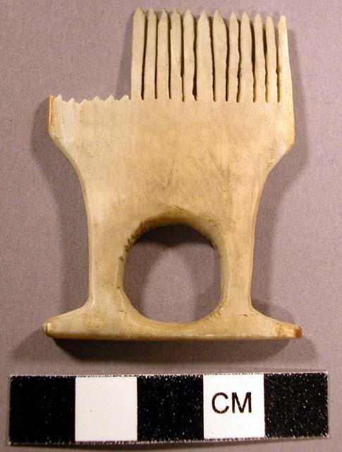 Ivory toilet comb