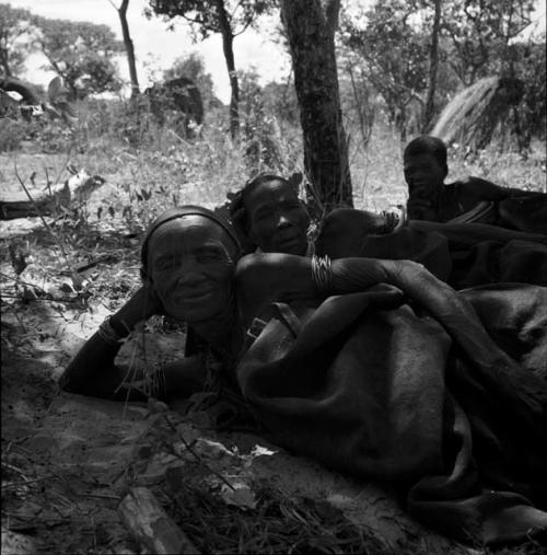 Three people lying on the ground in the werft