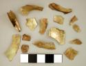 30 (approx.) thin fragments of gold