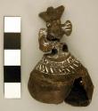 Gold bell with bird figures at top