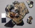Metal fragments, gold platted, very corroded