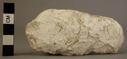 Small unpolished flint celt - note white patina