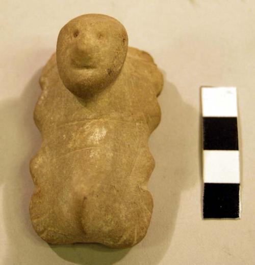 Stone amulet (human figure). Dripstone (stalactite)