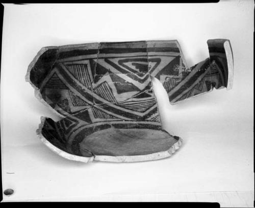 Photograph and negative of painted ceramics from the Jeddito Expedition, page 108