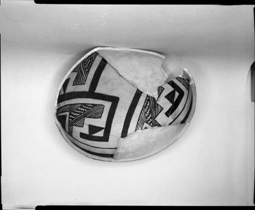 Photograph and negative of painted ceramics from the Jeddito Expedition, page 144