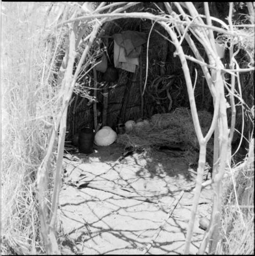 Possessions and grass inside a skerm