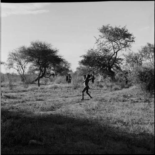 Boys playing a stick-throwing game