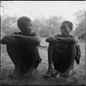 Gau sitting with another man, talking