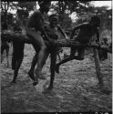 Boys playing on a merry-go-round