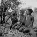 Three boys playing !ó'm!hú / !’Om g!xuni / ’Ai kota !U!u g!xuni / N!aih //’an (the porcupine game, also known as the axe game, assegai game or war game)