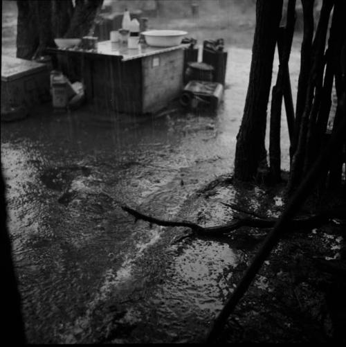 Table with food in the rain, view from the expedition hut