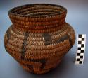 Medium-sized, jar-shaped basket. Made of bear grass and devil's claw.