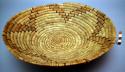Medium sized bowl-like basket tray. Made of yucca (natural and dyed).