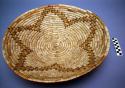 Medium basket tray, coiled. Made of bear grass (natural and dyed).