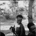 Boys playing /Ui (the counting game) in the sand