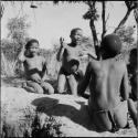 Boys playing !ó'm!hú / !’Om g!xuni / ’Ai kota !U!u g!xuni / N!aih //’an (the porcupine game, also known as the axe game, assegai game or war game)