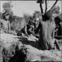 Boys playing !ó'm!hú / !’Om g!xuni / ’Ai kota !U!u g!xuni / N!aih //’an (the porcupine game, also known as the axe game, assegai game or war game)