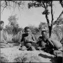 Boys playing !ó'm!hú / !’Om g!xuni / ’Ai kota !U!u g!xuni / N!aih //’an (the porcupine game, also known as the axe game, assegai game or war game)