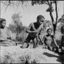 Boys playing !ó'm!hú / !’Om g!xuni / ’Ai kota !U!u g!xuni / N!aih //’an (the porcupine game, also known as the axe game, assegai game or war game)