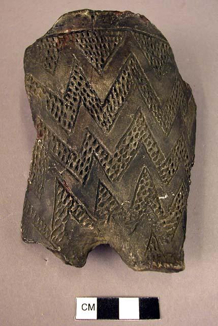 Cast of sherd with incised triangles and zigzags, all filled with punctations