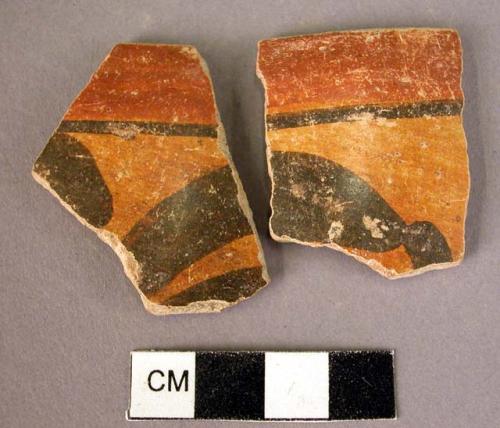 Rim sherds (2)--part of same vessel.  Outer surface decorated black on yellow gr