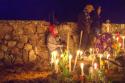 "Tzintzuntzan; the cemetery is decorated and attended by relatives of the departed"