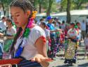 "Parade at the Plaza Grande, Patzcuaro, girl sprinkling confetti"