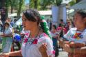 "Parade at the Plaza Grande, Patzcuaro, two girls sprinking confetti"