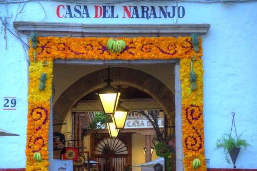 "Business entrance decorated with flowers and fresh fruit"