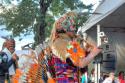 "Plaza Grande; Inka Azteka, Ecuador, (performer with animal skin, orange feathers)"
