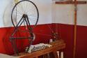 "Display at Casa de Once Patios (House of 11 Patios), spinning wheel"