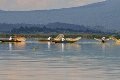 "Five boats of butterfly net fisherman on Lago Patzcuaro"