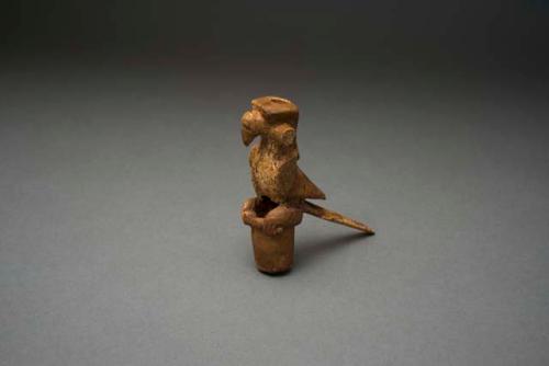 Organic, carved bone bird effigy, repaired, parts reconstructed with clay