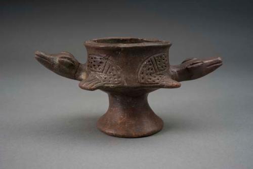 Small animal effigy vessel of brown ware