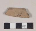 Brown bodied earthenware body sherd, with brown slip, reduced core, wheel thrown
