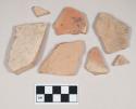Red bodied earthenware body sherds, with buff slip, reduced core; four sherds crossmend