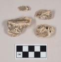 Animal jawbone fragments, with tooth fragments attached; three fragments crossmend