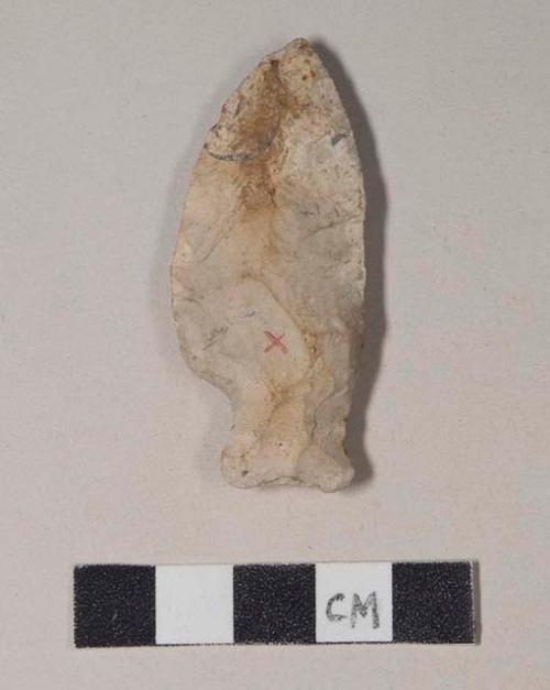 Chipped stone, projectile point, side-notched; one side appears to have been retouched