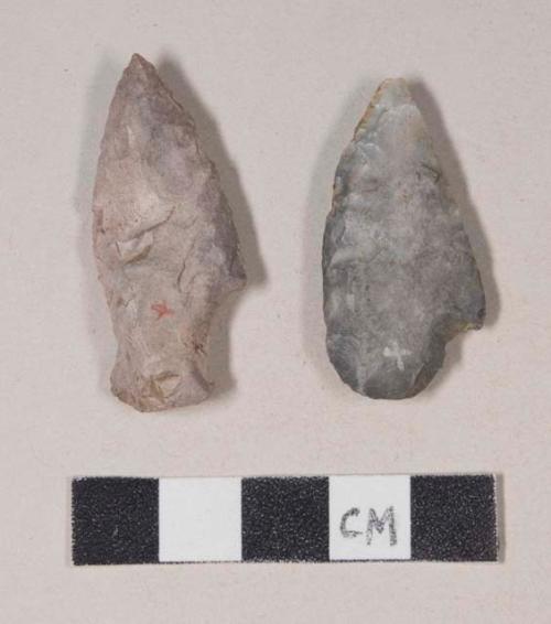 Chipped stone, projectile point, stemmed, asymmetrical, possibly reworked