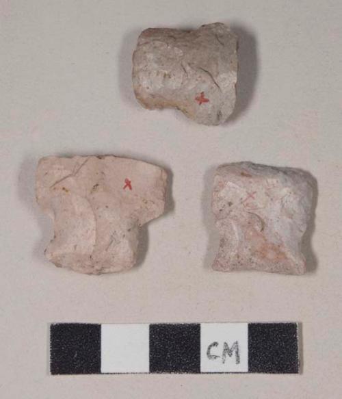 Chipped stone, side-notched projectile points reworked into scrapers