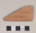 Red bodied earthenware rim sherd, unslipped, with red slipped stripes, reduced core