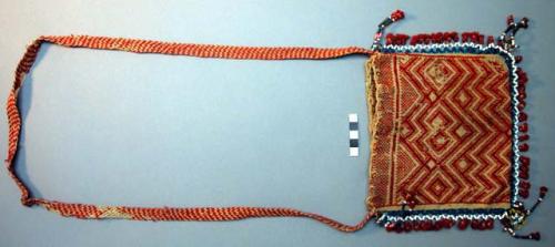 Textile wallet ornamented with beads